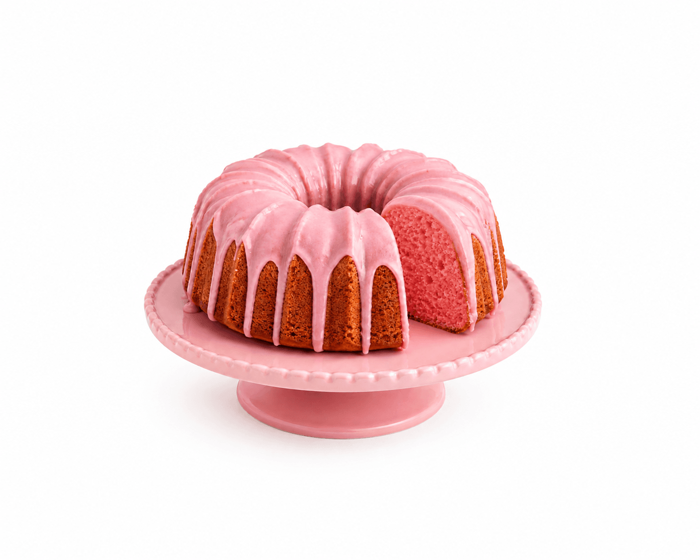 Glazed pink bundt cake on a serving plate